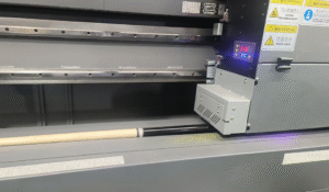 Obrighr Factory Live A Hornet industrial UV printer applying high-precision, cured graphics onto cue shaftsbutts for long-lasting, complex pattern adhesion.